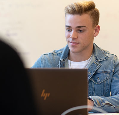 Online Campus Student working on laptop