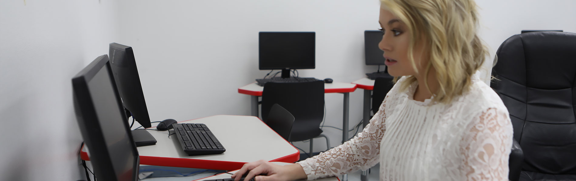 Student typing on computer 