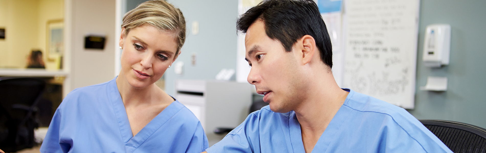 Two Healthcare professionals discussing medical procedures