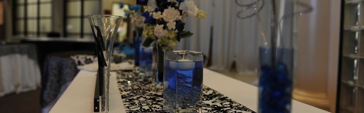 Table Setting table setting with blue candles and lilies in vases