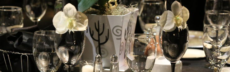 Table Setting Table setting with white cactus vase, white flower napkin rings stuffed in wine glasses