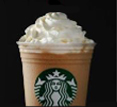 "白巧克力 Frap" with whipped cream and drizzle inside a clear Starbucks plastic cup.