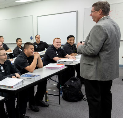 Adjunct Faculty Instructor teaching in classroom of Police Academy students