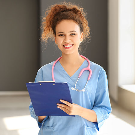 RN-to-BSN Bridge Nurse with stethescope around neck while holding a clipboard